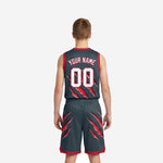 Right-side view of grey and red youth basketball uniform set showing diagonal claw marks across jersey and shorts