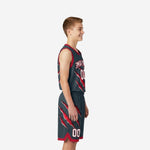 Side view of custom grey and red claw-slash youth basketball uniform set showing jersey length and shorts claw print