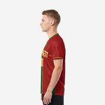 Right side view of a men's custom soccer jersey in Dark Red and Forest Green showing contrast panel construction and V-neck collar