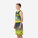 Right side view of youth basketball jersey and shorts set with hex texture gradient and chevron shorts hem detail