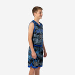 Youth boy wearing grey and royal blue camo basketball uniform set showing full two-piece jersey and shorts design