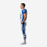 Opposite side view of sublimated white and blue football uniform set showing jersey side panel and pant stripe detail