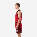Opposite side view of custom adult league basketball uniforms in red with black lightning graphic and matching shorts