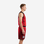 Side view of red and black sublimated adult league basketball uniforms showing lightning-crack pattern on jersey and shorts