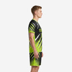 Custom all black neon green soccer uniform side view showing edge to edge sublimation graphic on jersey and shorts