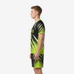 Men's custom all black soccer uniform side view right showing neon green lightning bolt and halftone dot fade design