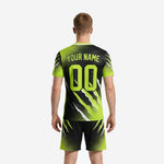 Close detail of custom all black soccer jersey with neon green full-dye sublimation claw-mark and lightning graphic