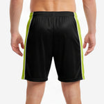 Close-up of lime green side panel and white pinstripe accent on custom all black soccer shorts