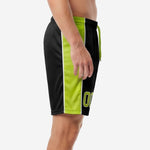 Custom all black soccer shorts showing wide lime green contrast side panel with white pinstripe, left side view