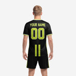 All black sublimated soccer jersey with lime green center stripe and white crew neck trim, close detail