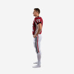 Left side view of custom american football uniform set showing V-neck collar, white side panel on jersey, and full-length double stripe on white football pants