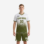 Custom army green soccer uniforms full kit front view showing pixel-scatter gradient jersey and matching shorts on adult male model
