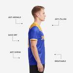 Gold-and-white banded sleeve cuff trim detail on custom Royal Blue soccer jersey, sublimated full-dye construction