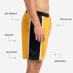 Custom neon yellow soccer shorts bold black player number printed on lower right leg via full-dye sublimation