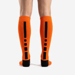 Custom Athletic Orange soccer socks close-up of ribbed calf panel showing sublimation print zone for club crest