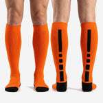 Custom Athletic Orange soccer socks pair flat lay showing full over the calf length and solid orange body