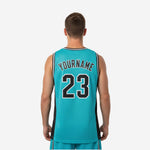 Right side view of custom mens basketball jersey in teal with black side panel and black and white stripe armhole trim detail