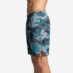 Left side view of sublimated grey and teal camo basketball uniform shorts showing side split at the hem