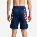 Matching team basketball shorts in navy blue with white star pattern and red white diagonal side stripe, back view showing full sublimation coverage