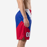 Front view of custom basketball shorts for teams showing bold diagonal tri-color red white and royal blue sublimated design