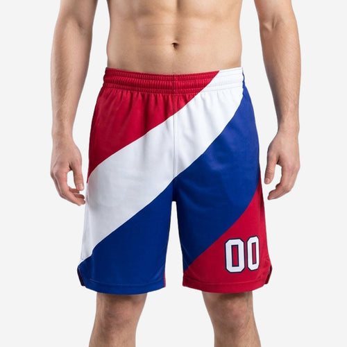 Custom basketball shorts for teams in diagonal red, white, and royal blue color block with player number 00 on front leg panel