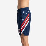 Custom basketball shorts for teams showing navy body and red white chevron stripe wrapping the opposite side panel, hem split detail visible