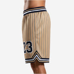 Player number zone detail on custom basketball shorts with team logo placement on white and navy design