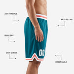 Back view of teal custom basketball shorts with coral and white chevron hem and sublimated player number on lower back thigh