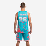 Custom basketball uniform teal base with coral pink splash graphics and crew neck trim detail