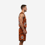 Orange and black custom basketball uniforms with logo showing jersey front with tiger face crest and matching tiger stripe shorts with leg number