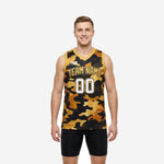 Custom black and gold basketball jerseys with full camo print, team name arc, and white outlined front and back numbers on male model