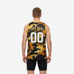 Right side view of gold and black camo basketball jersey showing straight hem and athletic cut torso on male model