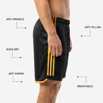 Custom black and gold soccer shorts hem detail showing gold trim stripe at leg opening