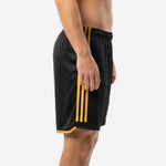 Custom black and gold soccer shorts side view showing three gold stripes along the outer leg panel