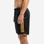 Custom black and gold soccer shorts opposite side view with gold contrast stripe panels and straight hem trim