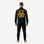 Custom black and gold soccer tracksuit jacket detail showing stand collar, full zip, and sublimated gold contrast panels