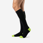Custom black and green soccer socks right side view showing neon green heel and toe sublimated accent zones
