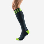 Custom black and green soccer socks right side view showing charcoal calf panel and neon green toe box