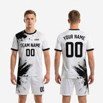 Close-up of crew neckline with black contrast rib trim on custom black and white soccer jersey
