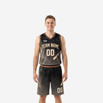 Custom black basketball uniform with gold comet galaxy print, arched team name and number 00 on jersey and matching shorts - front view