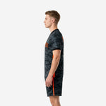 Sublimated black soccer kits for men with orange stripe shorts, right side view