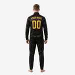 Custom black and gold soccer tracksuit jacket front detail showing team logo placement and player number on chest