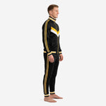 Custom black and gold soccer tracksuit side view showing twin stripe down sleeve and pant leg