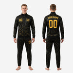 Custom black and gold soccer tracksuit gold ornamental pattern closeup showing full-dye sublimation depth across polyester fabric