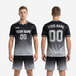 Custom black and gray soccer shorts showing white side stripe and gradient fade from black waistband to silver hem