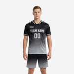 Custom black and gray soccer uniforms front view showing gradient jersey and matching shorts on male model