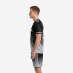 Custom black and gray soccer uniforms right side view showing back number placement and gradient fade detail