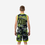 Opposite side view of custom black camo youth basketball uniform set with neon electric-crack pattern on jersey and shorts
