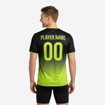 Detail view of full-dye sublimation gradient print on custom black and neon green training jersey