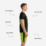Close-up of neon green custom soccer shorts with black side panel and sublimated player number on left leg